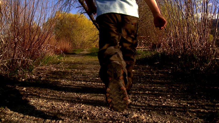 Young boy running in nature