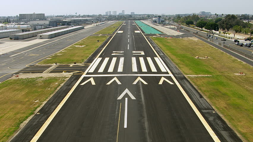Landing on airport runway, aerial shot