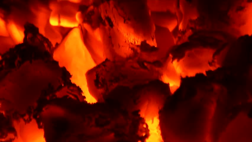 Glowing, blazing wood embers of a dying fire. Clip Six
