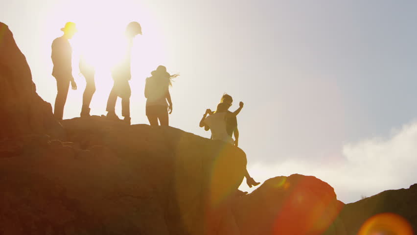 Group of young people on rocks 