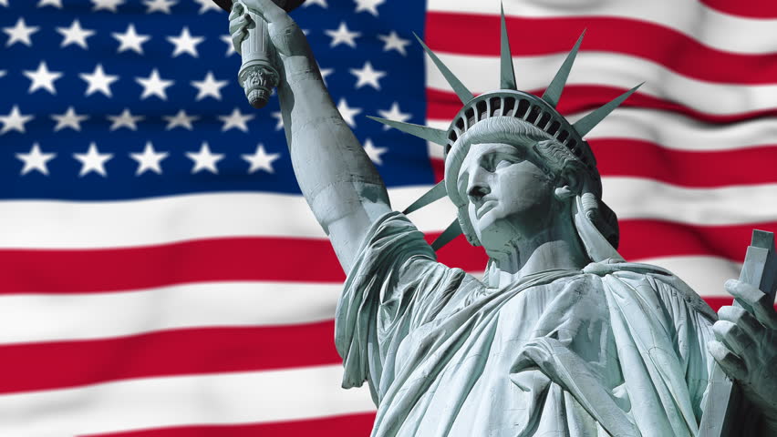 Statue of Liberty with US flag in background