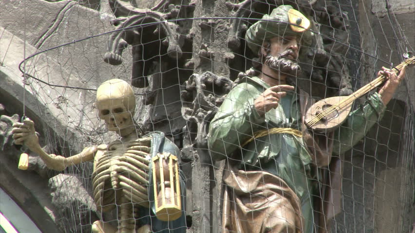 Close-up of astronomical clock on gothic Old Town Hall tower in Prague. Zoom out.