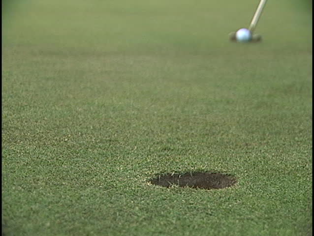 Putt that makes it to the cup!  Shot low ground level close up. GREAT SOUNDS!
