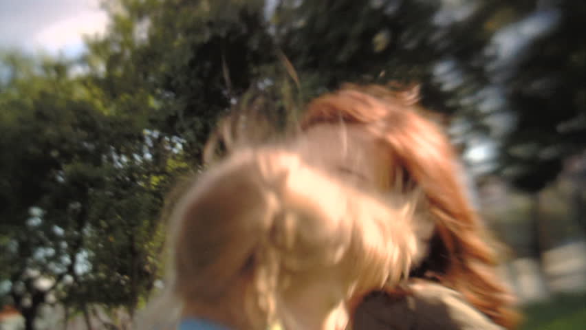 Sequence of soft focus shots. Happy family playing in the park