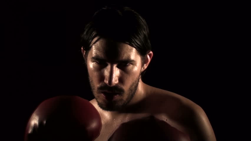 Male boxer punches in slow-mo