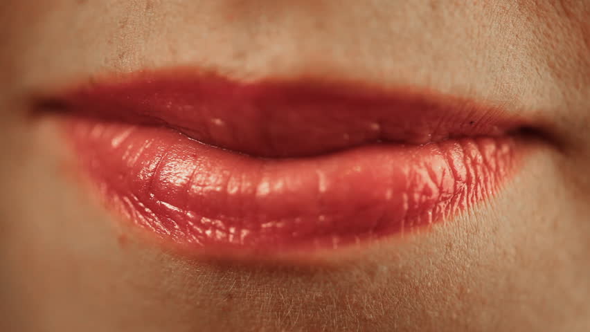 Sensual red lips of young woman 