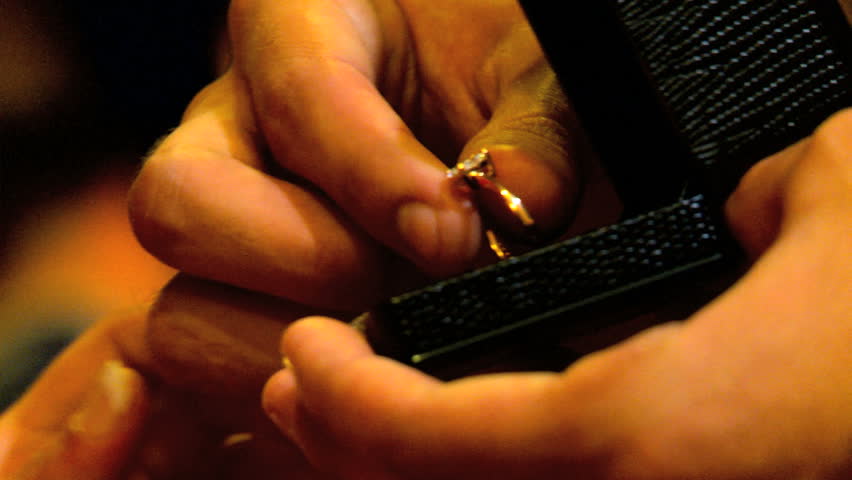 Diamond ring being placed on female finger during marriage proposal in close-up
