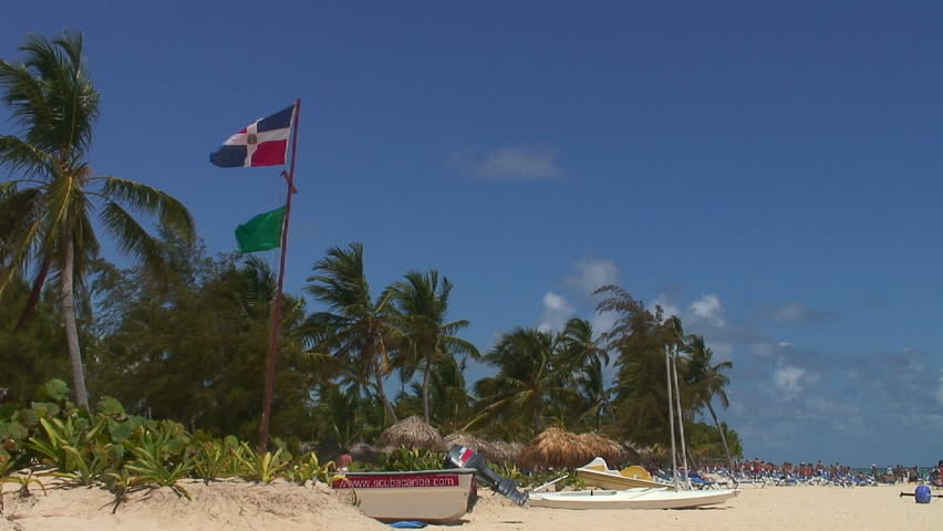 Dominican Republic flag on the beach. HD 1080