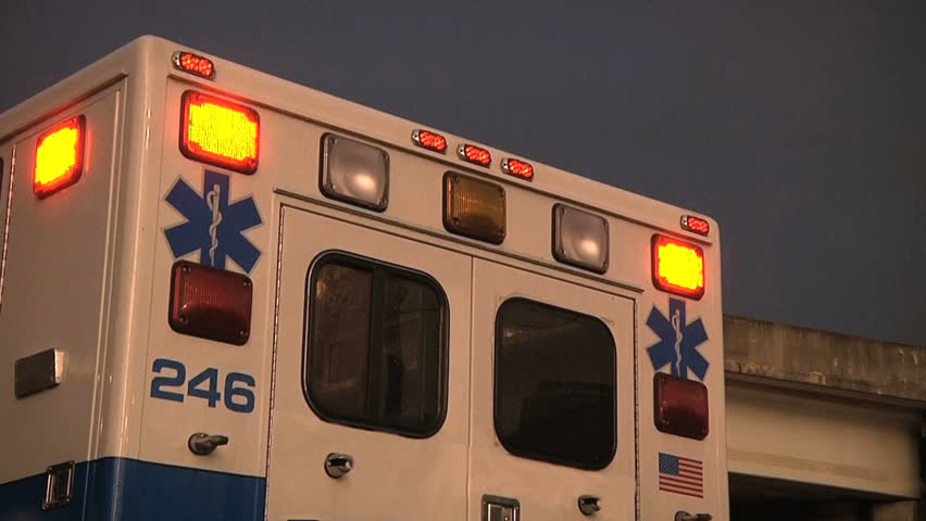 Rear doors and flashing lights of a city hospital ambulance.  