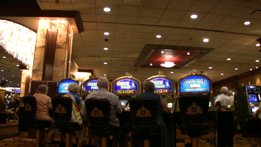 People playing slot machines in Trump Plaza casino
