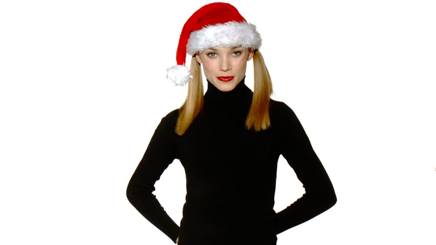 Portrait of beautiful sexy girl wearing santa claus hat showing boxed gifts 