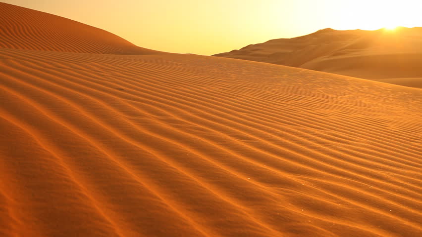 sunset in desert with light wind, loop