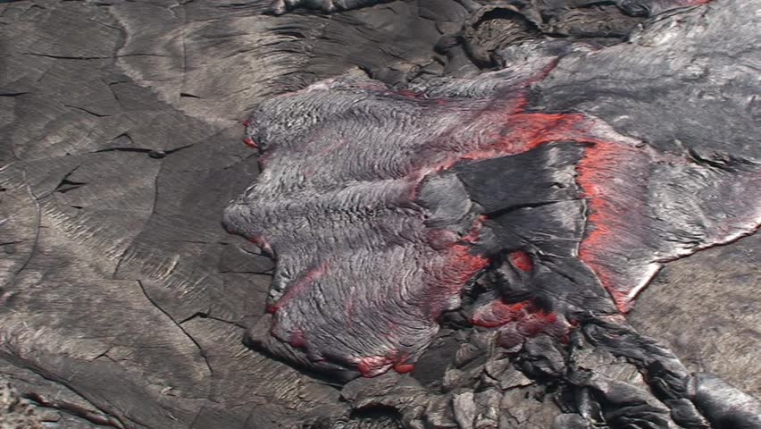 Overflow within the volcano Erta Ale crater with its active lava lake