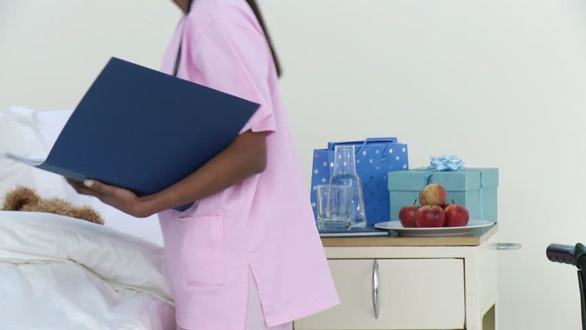 Panorama of little patient recovering in hospital talking to a nurse. Concept of healthcare. Footage in high definition
