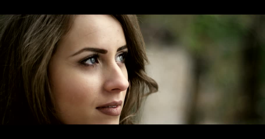 Close on the face of a bride in her wedding dress