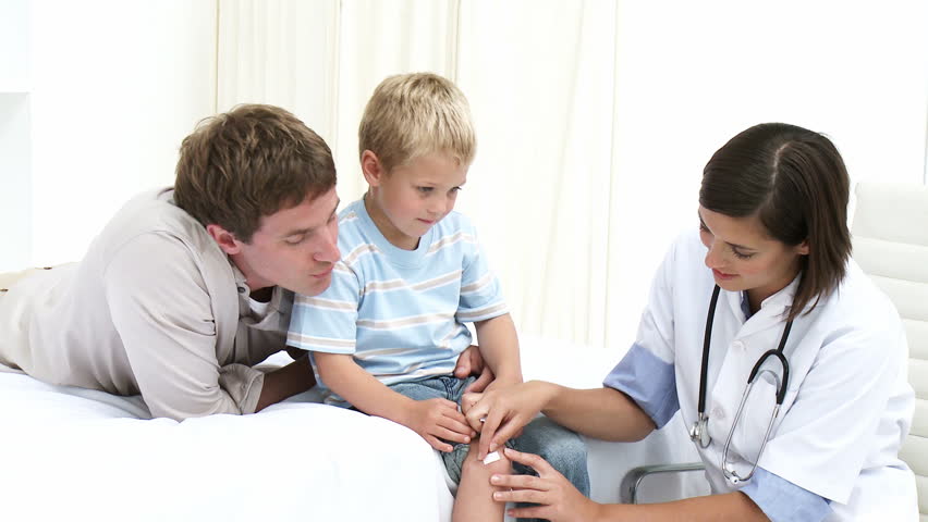 Father bringing his son to the doctor in HD 1080p 