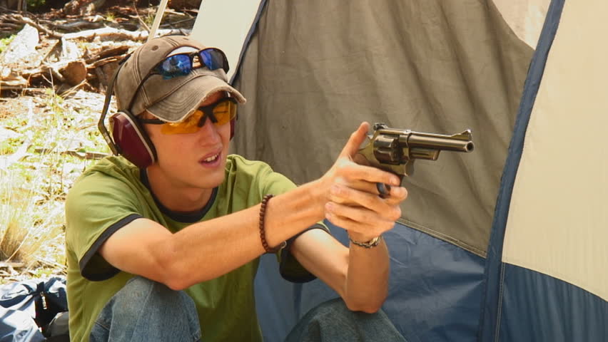 young man fires three shots from .357 magnum Smith & Wesson revolver