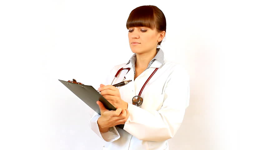Female doctor recording something on notepad