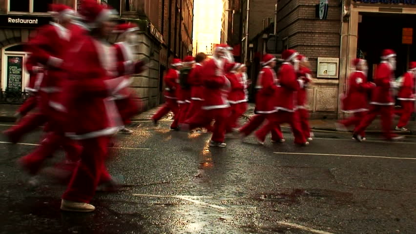 LIVERPOOL - DECEMBER 6: Thousands of runners take part in the annual "Santa Dash" for charity in December 6, 2009in Liverpool, England. 