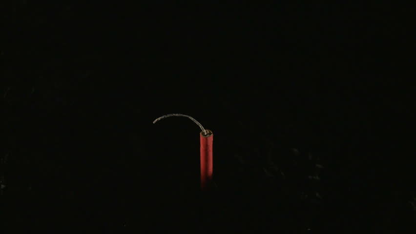 Firecracker being lit with match and exploding 