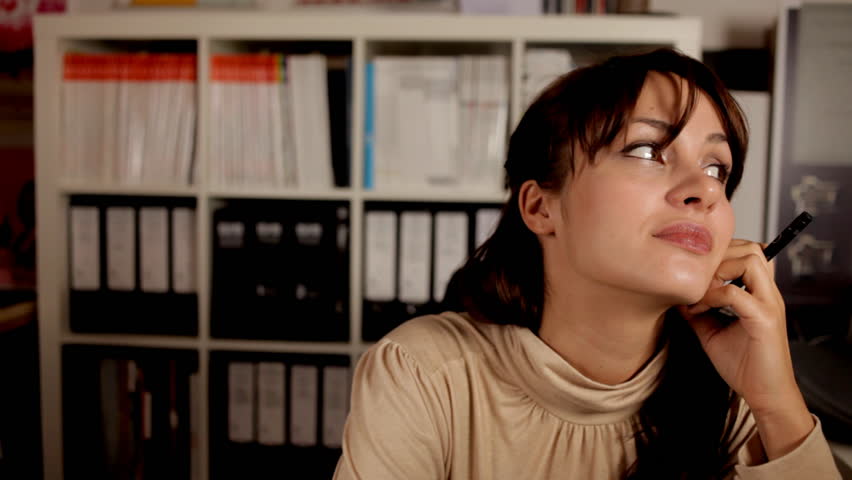 a pretty business woman or secretary in an office