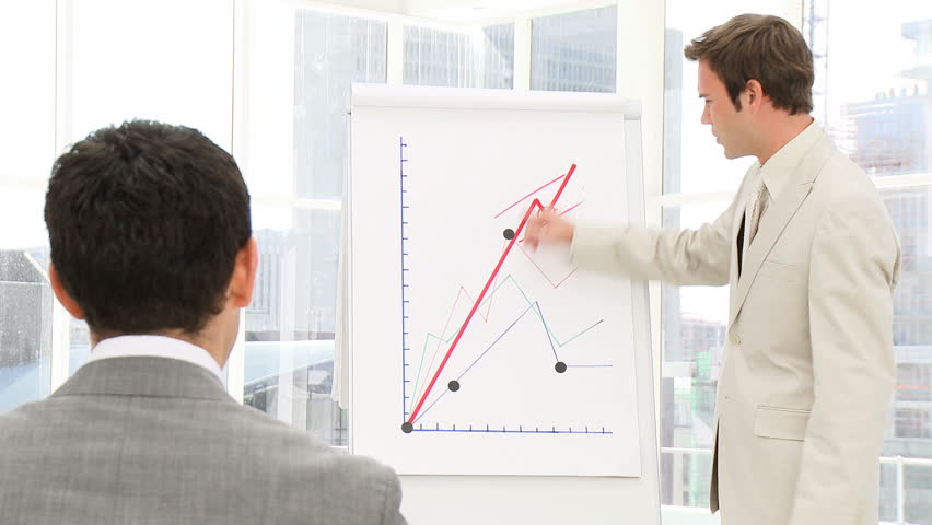 Confident businessman doing a presentation to his associates