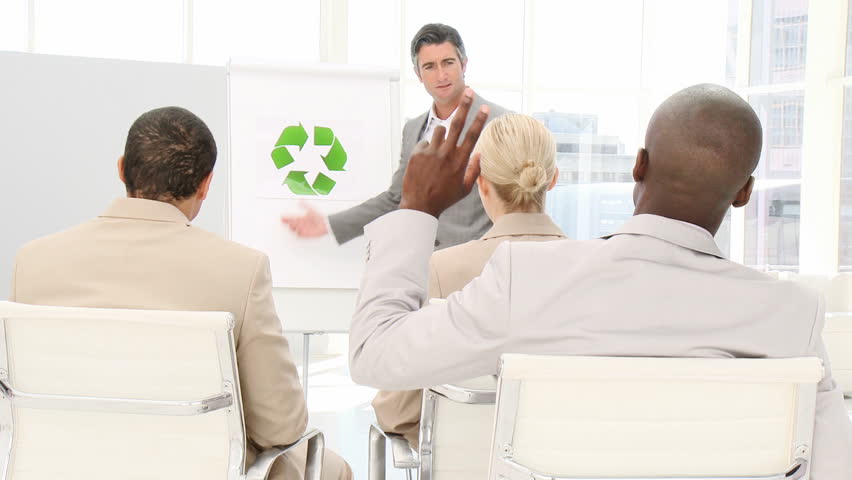 Confident business man presenting the concept of recycling in a company