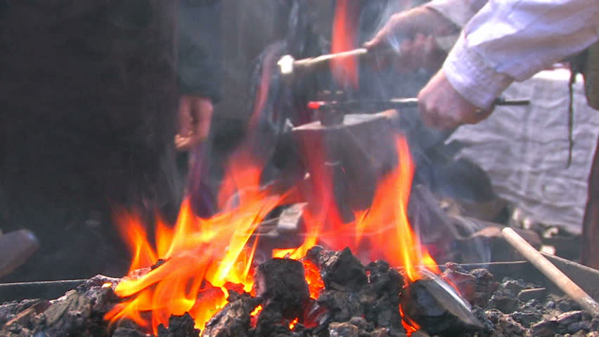HD Demonstrative work of some blacksmiths with forge foreground, Canon XH A1, FullHD video, 1080p, 25fps, progressive scan 