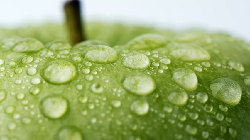 Dew on the green apple. Macro shot