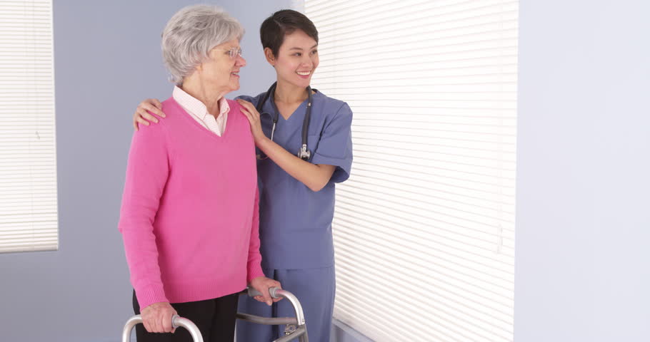 Mature Caucasian Woman Being Consoled By Japanese Nurse Stock Footage