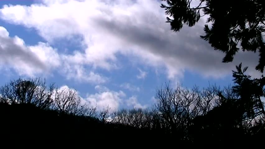 Soft white and gray cloud is smeared across the skyline in this time-lapse