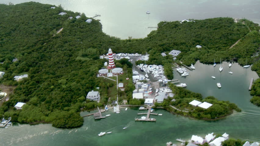 Aerial shot of lighthouse and marina in the Bahamas