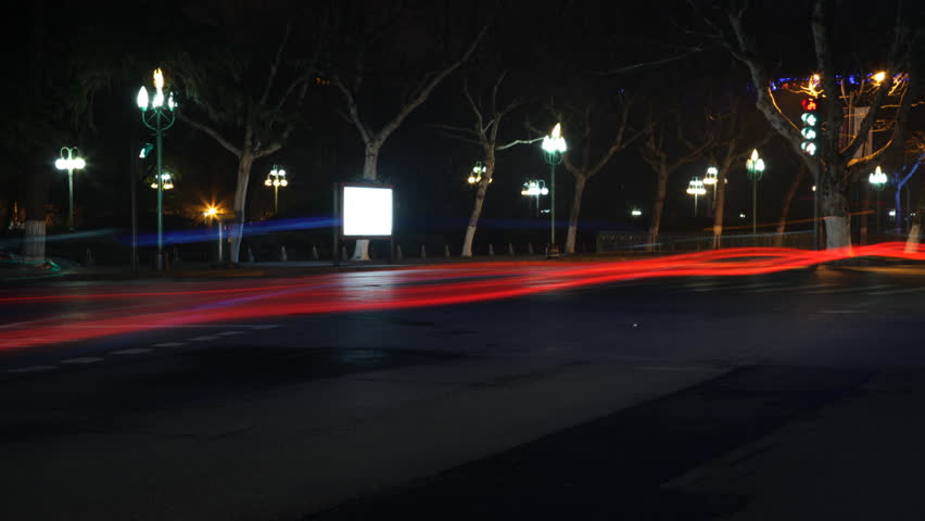 Stop Motion Night city Traffic with road reflections & tail lights