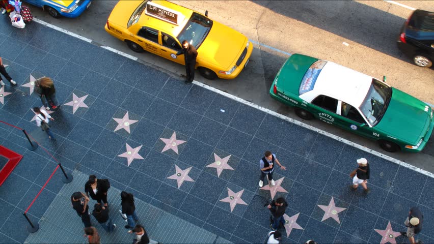 LOS ANGELES - APRIL 6: People walking on famous Walk of Fame at Hollywood Blvd. HD Time lapse. April 6, 2010 in Los Angeles, California.
