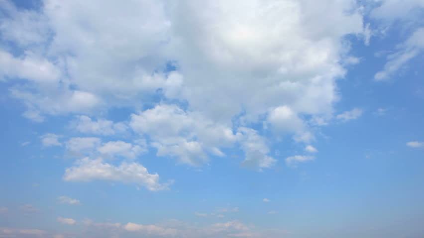 Time laps. White clouds at midday