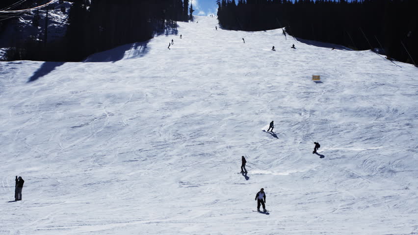 Time lapse of hundreds of skiers skiing down a mountain in the Rocky Mountains of Colorado. HD 1080p