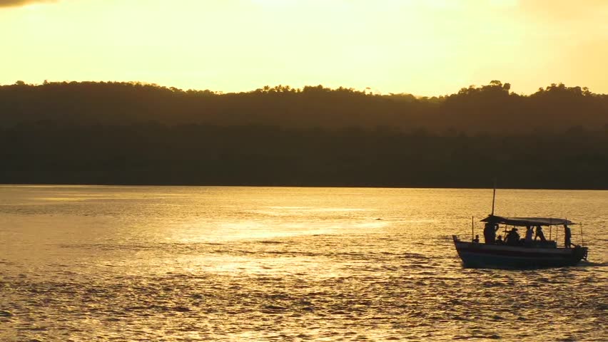 Tourist boat at the sunset