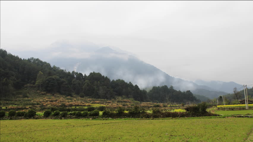 time lapse of cloud crossing over mountain