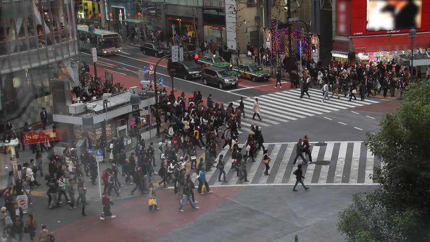 Pedestrians crossing street in busy downtown shibuya Tokyo, Japan, time-lapse