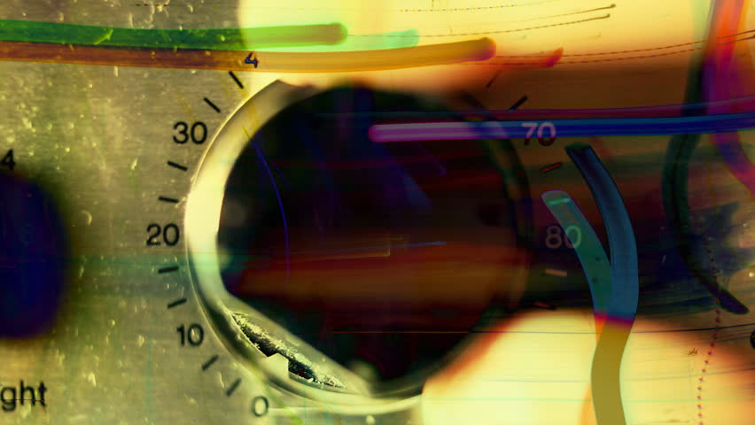 closeup of hand turning a volume control on an old hifi