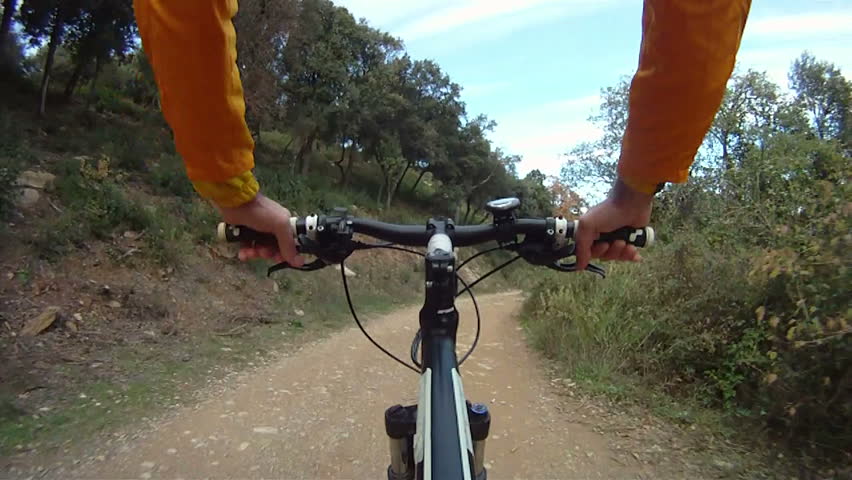 Man riding Mountain Bike along track