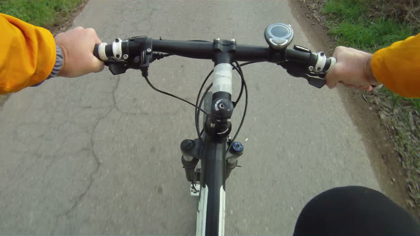 Man riding Mountain Bike along road