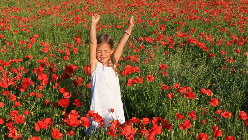 Girl surrounded by poppy flowers