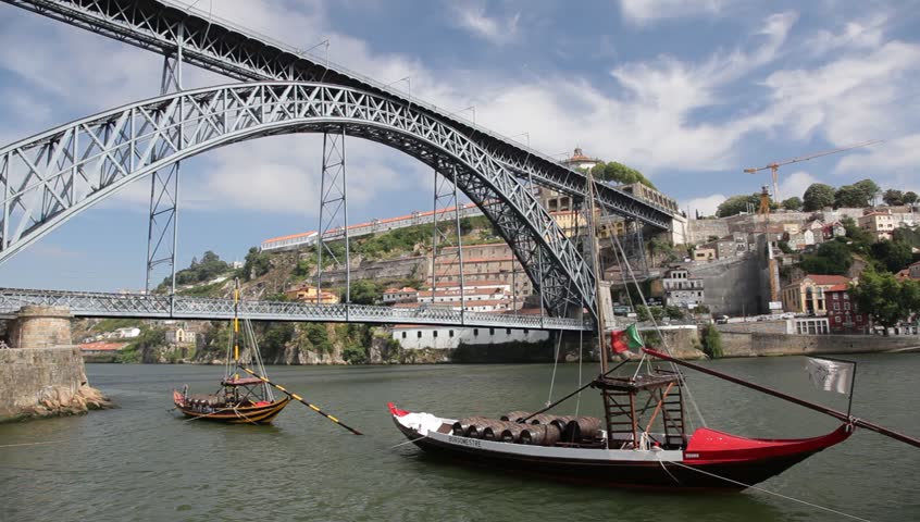 PORTO - JULY 03: Famous Dom Luis Bridge that spans the Douro River between the cities of Porto and Vila Nova de Gaia in Portugal. 