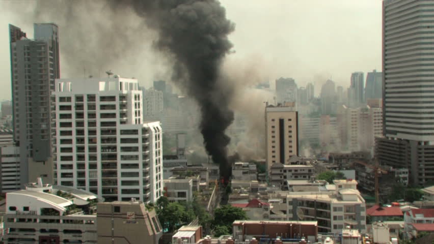 BANGKOK, THAILAND - April 19, 2010: Firemen battle blazes across the city after protesters set more than 40 buildings on fire during a government crackdown 