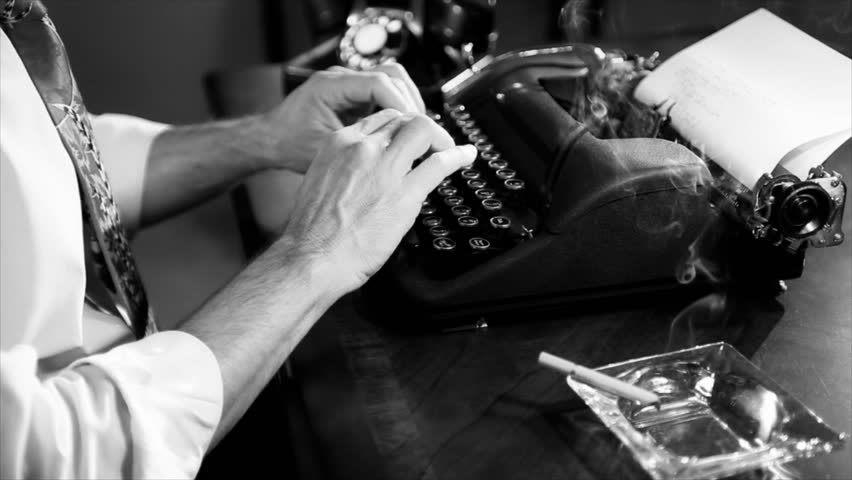 The camera pans up as a lit cigarette is picked up by a reporter typing on a manual typewriter. Film Noir