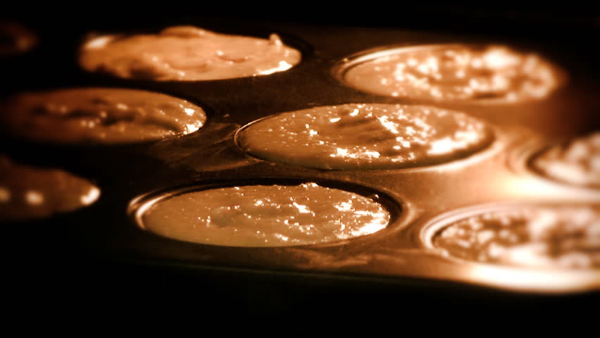 Selective focus shot of muffins baking, time-lapse