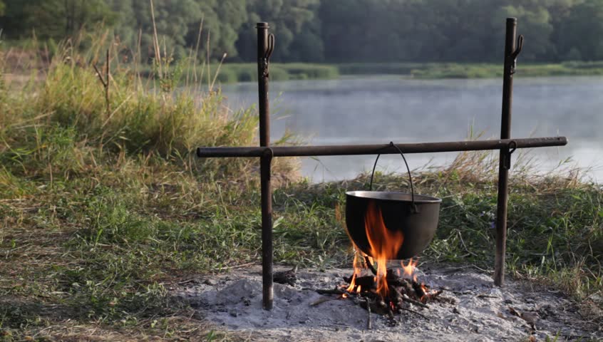 cooking outdoors over a campfire