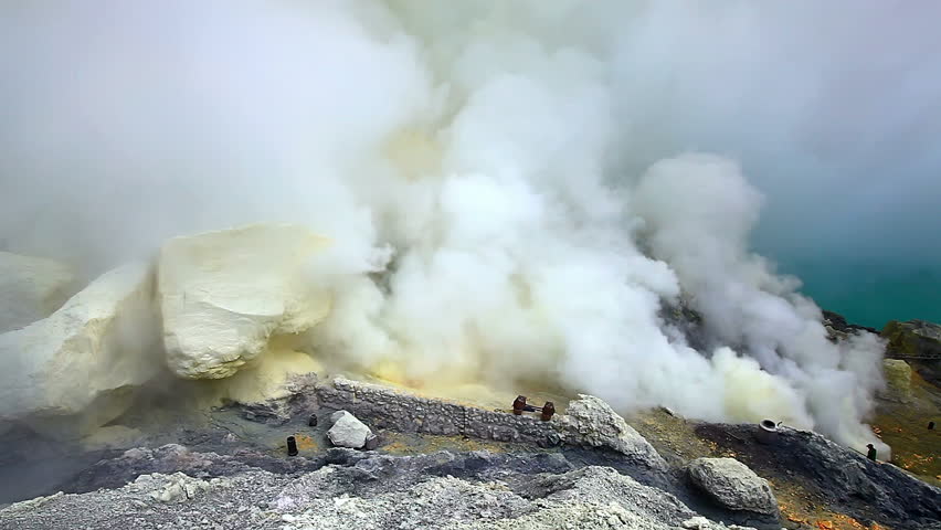 Close view on sulfur mine and acid crater lake at Ijen crater. East Java, Indonesia.