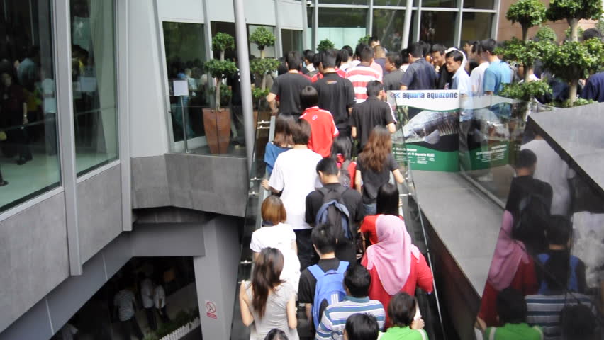 KUALA LUMPUR, MALAYSIA -AUGUST 8: Timelapse for massive crowd entering Pikom Computer Fair 2010 on August 8, 2010 at Kuala Lumpur Convention Center, Kuala Lumpur.